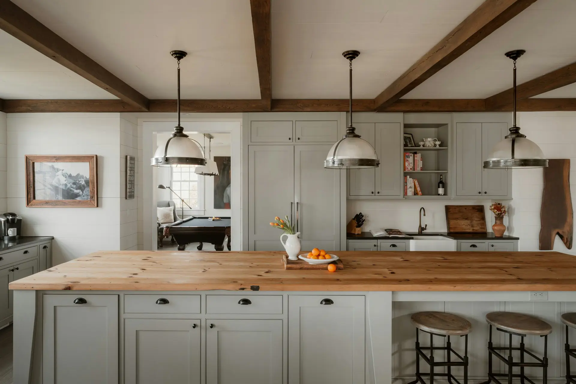 A farmhouse kitchen with a butcher-block island and pendant lights