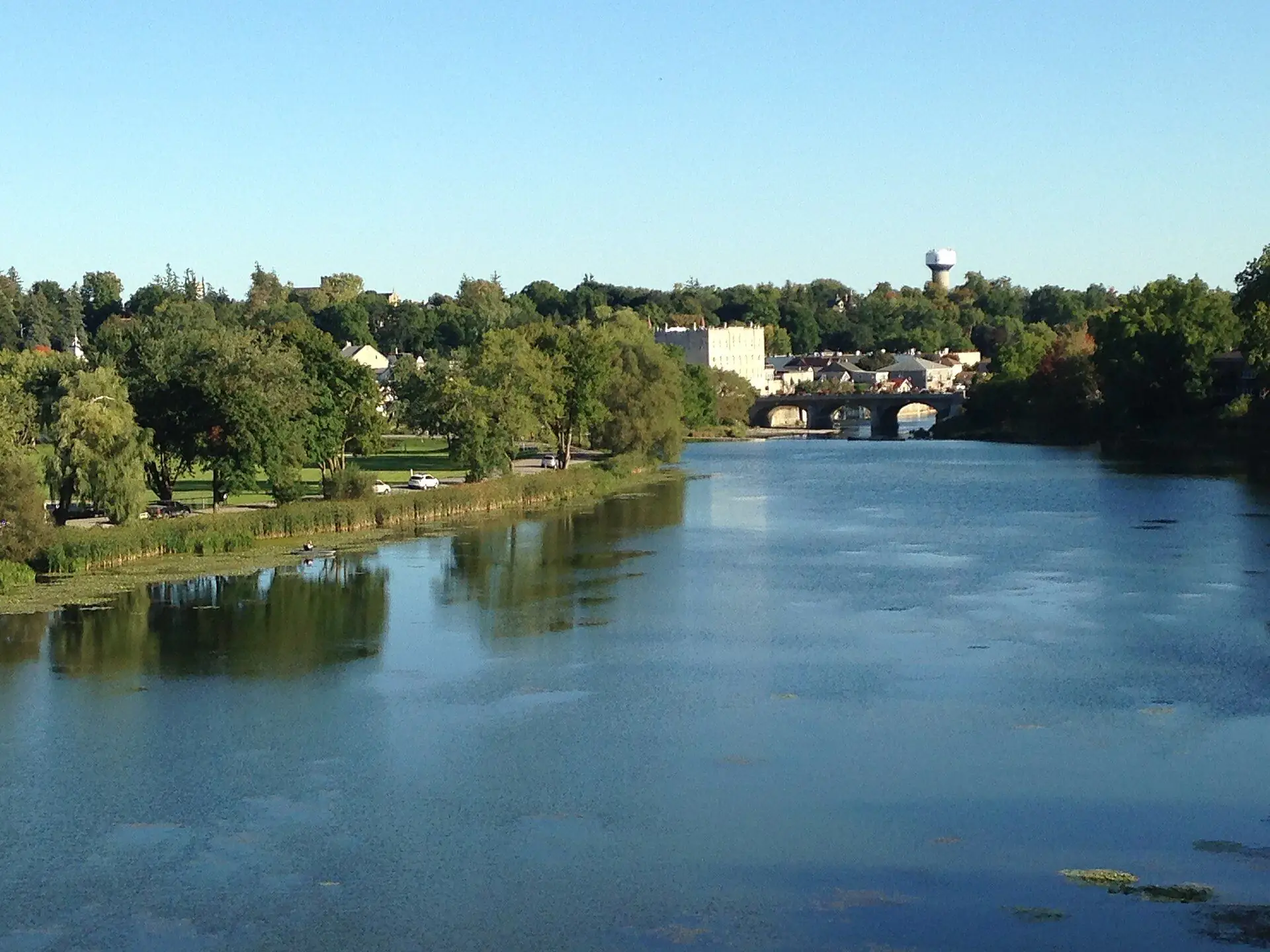 The stone bridge over the Thames in St. Marys, with the stone town hall and water tower beyond