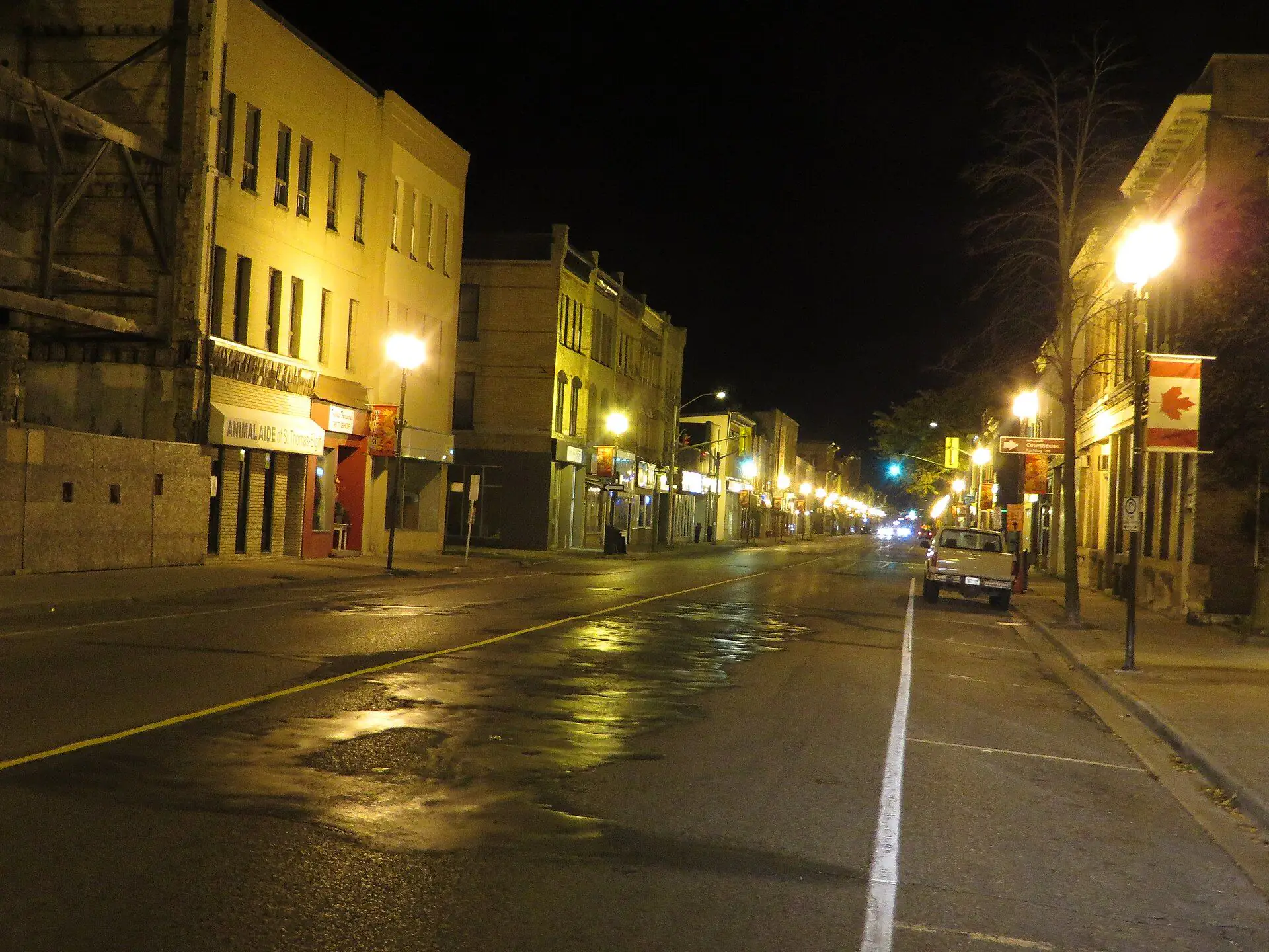 Streetlamps lighting the brick blocks along Talbot Street in downtown St. Thomas at night