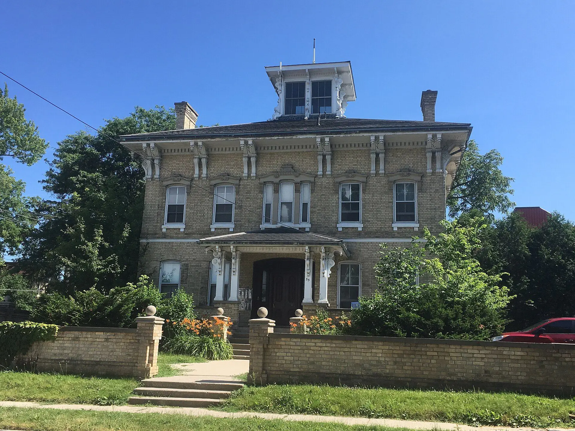 An Italianate buff-brick house with a rooftop belvedere on McClary Avenue in Old South