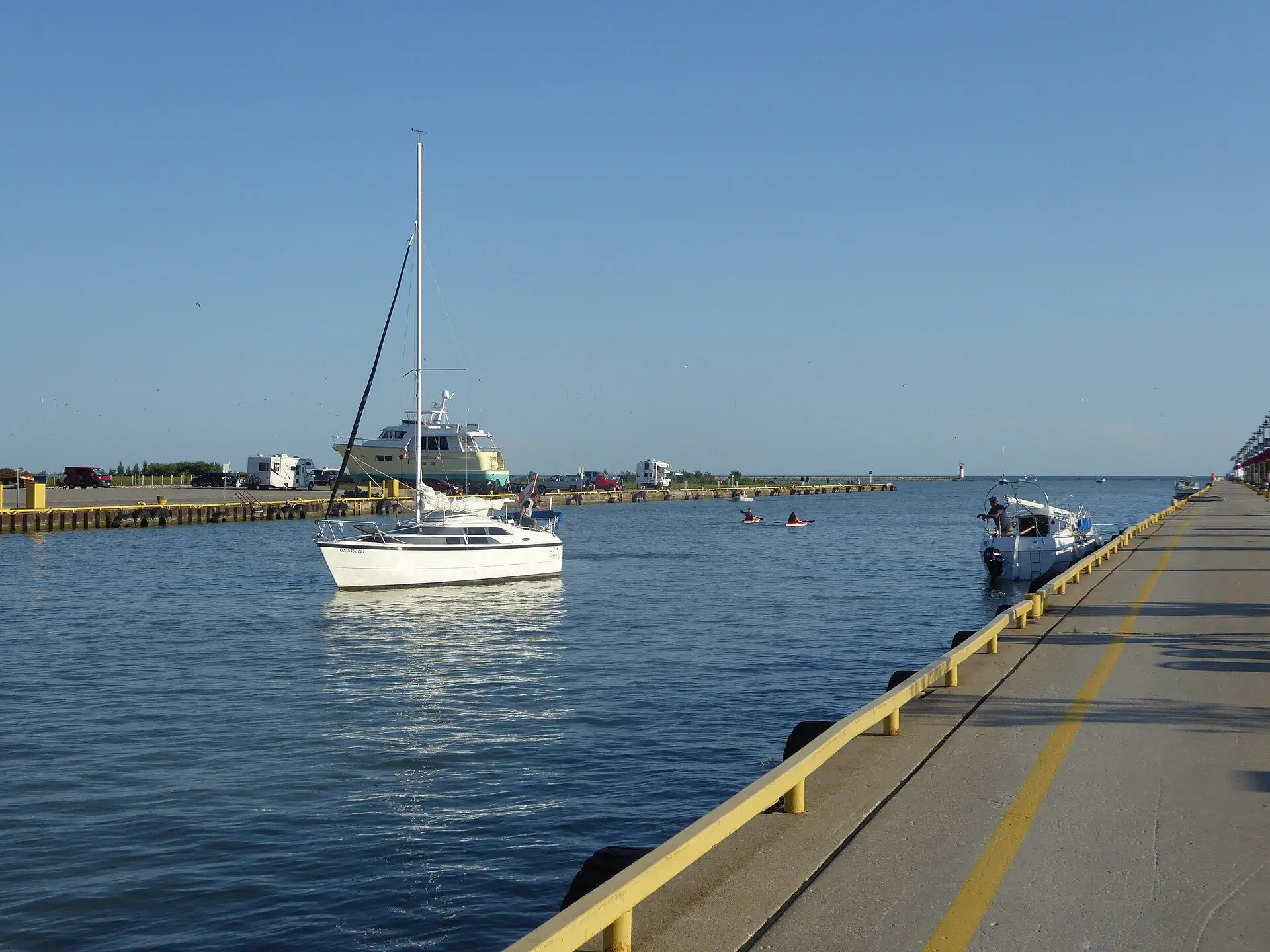 A sailboat at anchor in the harbour entrance at Port Stanley on Lake Erie