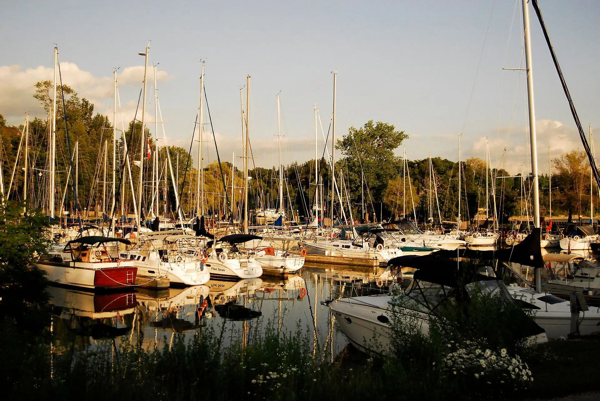 Boats moored at the Bayfield marina on a summer evening